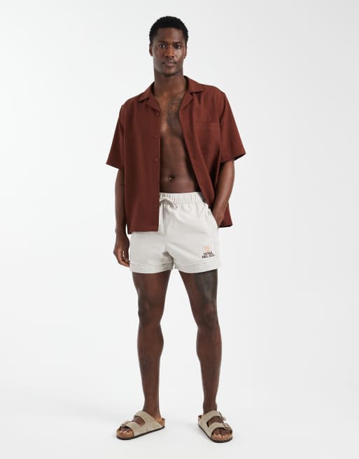 ASOS DESIGN swim shorts in short length with embroidery in beige, 3 of 6