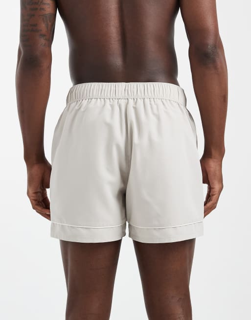 ASOS DESIGN swim shorts in short length with embroidery in beige, 5 of 6