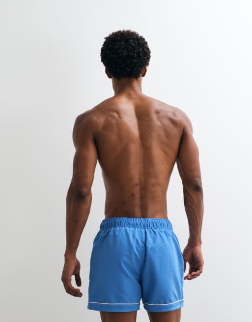 ASOS DESIGN swim shorts in short length with embroidery in blue, 4 of 5
