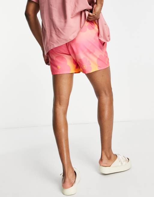 ASOS DESIGN swim shorts in short length with faded floral print in pink, 2 of 4
