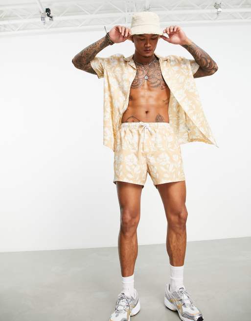 ASOS DESIGN swim shorts in short length with floral print in beige (part of a set)