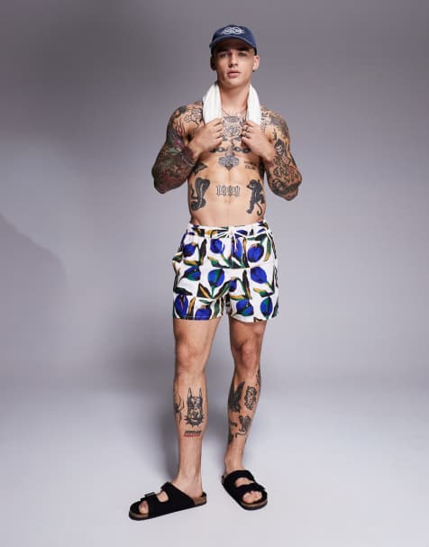 ASOS DESIGN swim shorts in short length with floral print in white - view 1