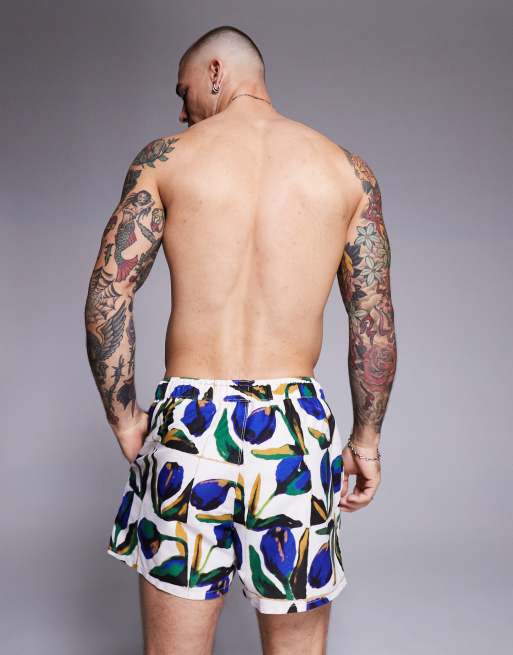 ASOS DESIGN swim shorts in short length with floral print in white, 4 of 4