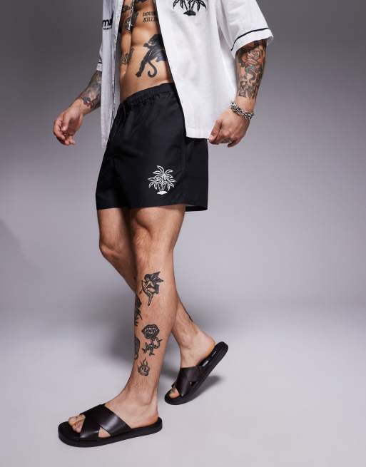 ASOS DESIGN swim shorts in short length with palm tree in embroidery in black - part of a set
