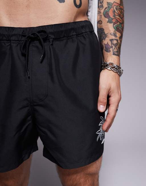 ASOS DESIGN swim shorts in short length with palm tree in embroidery in black - part of a set