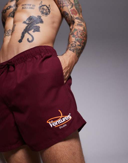 ASOS DESIGN swim shorts in short length with placement print in burgundy, 2 of 4