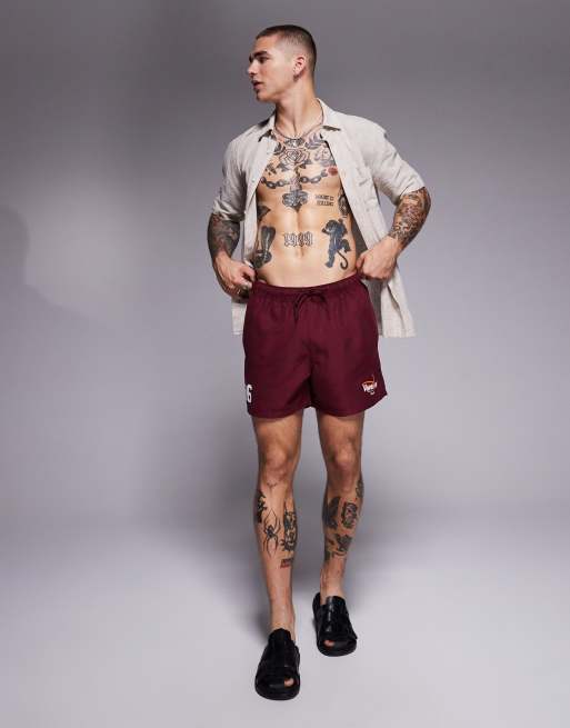 ASOS DESIGN swim shorts in short length with placement print in burgundy, 3 of 4