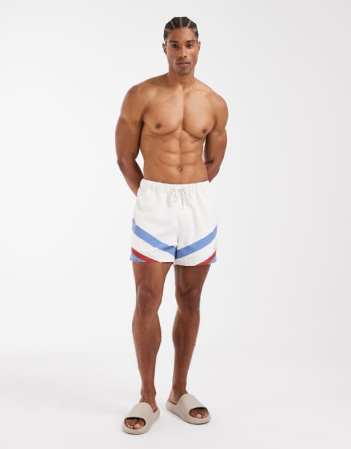 ASOS DESIGN swim shorts in short length with placement print in cream, 2 of 5