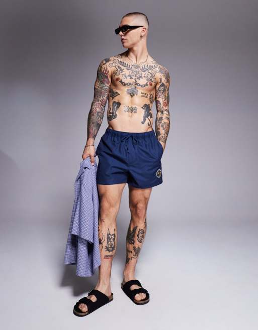 ASOS DESIGN swim shorts in short length with placement print in navy, 3 of 4