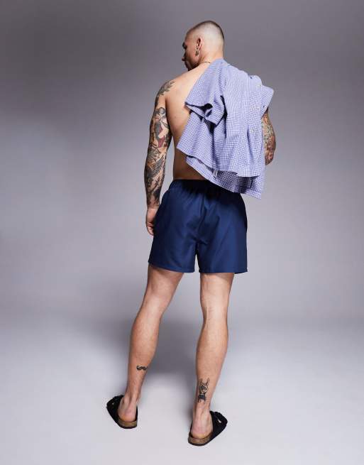 ASOS DESIGN swim shorts in short length with placement print in navy, 4 of 4