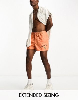 ASOS DESIGN swim shorts in short length with placement print in orange - ASOS Price Checker