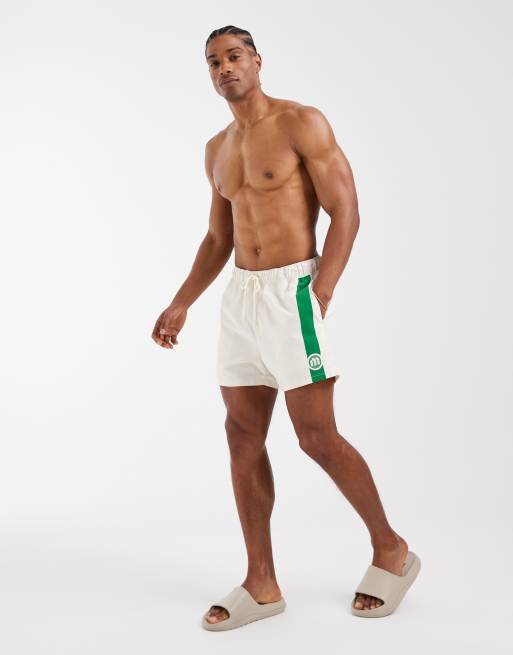 ASOS DESIGN swim shorts in short length with placement stripe in beige, 2 of 5