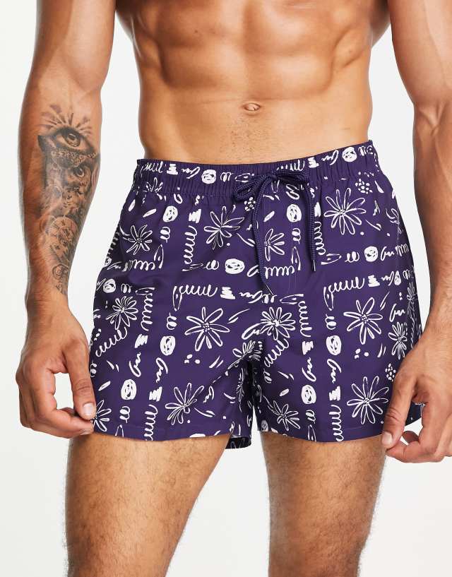 ASOS DESIGN swim shorts in short length with scribble floral print in navy