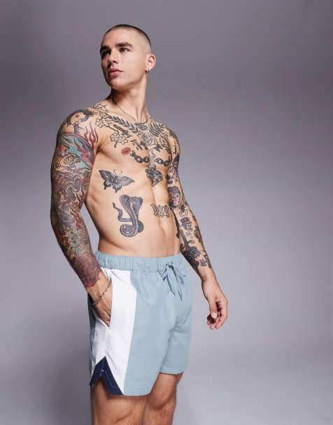 ASOS DESIGN swim shorts in short length with side vent cut and sew in blue - view 1