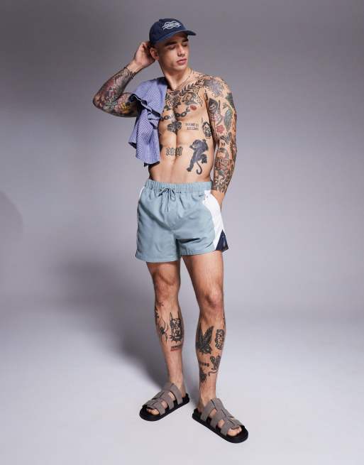 ASOS DESIGN swim shorts in short length with side vent cut and sew in blue, 3 of 4