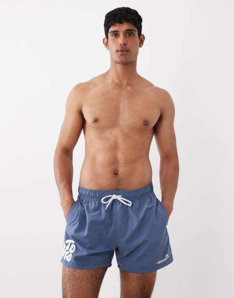 ASOS DESIGN swim shorts in short length with silicone bubble placement print in blue - view 1