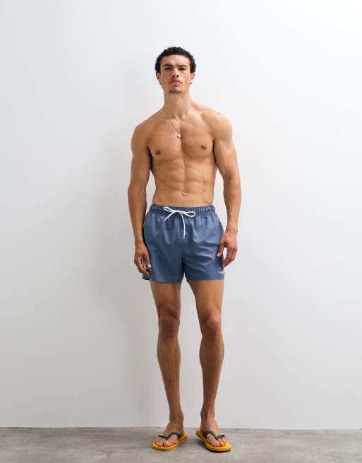 ASOS DESIGN swim shorts in short length with silicone bubble placement print in blue, 2 of 7