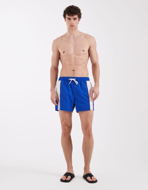 ASOS DESIGN swim shorts in short length with sporty panelling in blue, 4 of 6