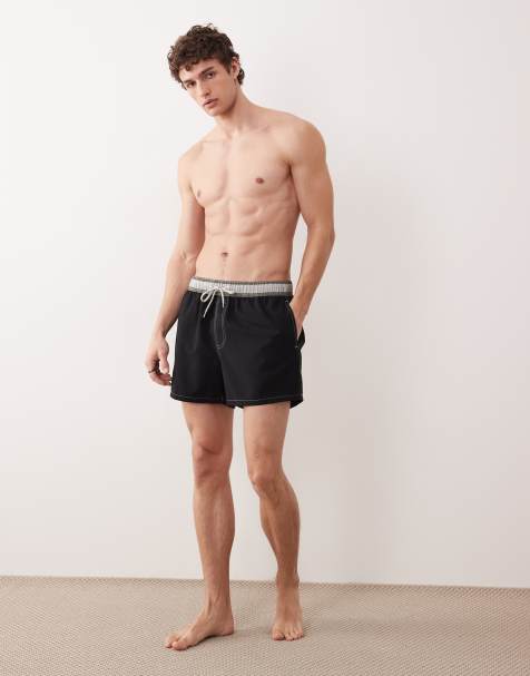 ASOS DESIGN swim shorts in short length with stripe waistband in black - view 1