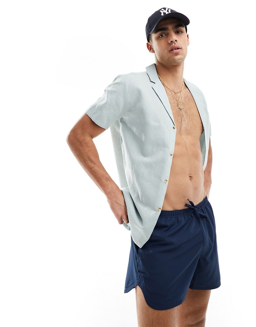 ASOS DESIGN swim shorts in short length with thin waistband in navy