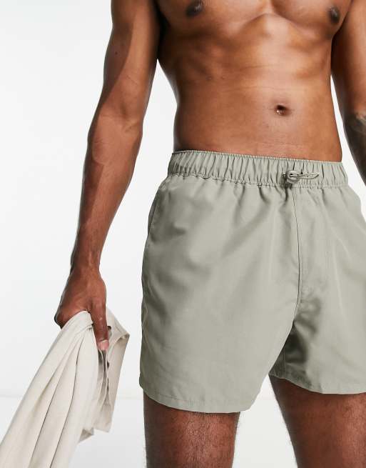 ASOS DESIGN swim shorts in short length with toggle waistband in light khaki