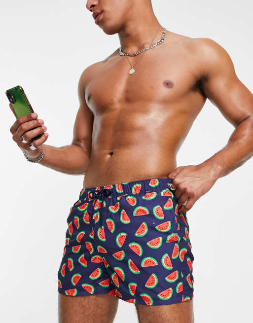 ASOS DESIGN swim shorts in short length with watermelon print in navy