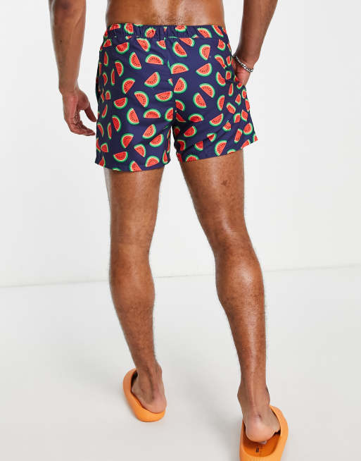 ASOS DESIGN swim shorts in short length with watermelon print in navy