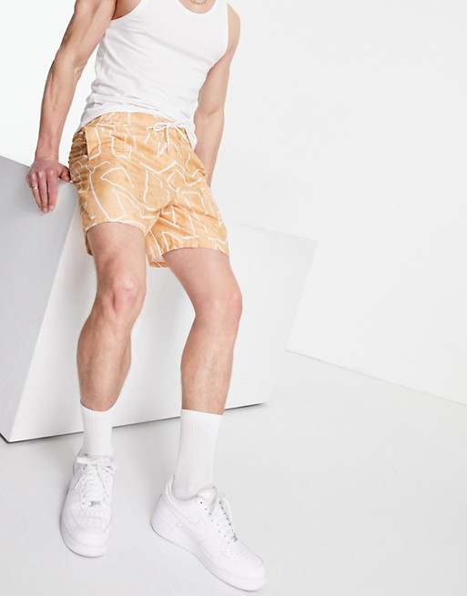 ASOS DESIGN swim shorts with abstract geo print in stone