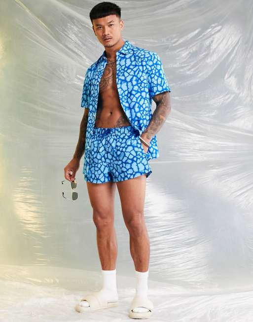 ASOS DESIGN swim shorts in super short length in blue animal print part of a set