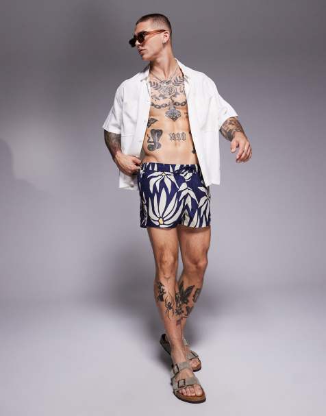 ASOS DESIGN swim shorts in super short length in daisy print in navy - view 1