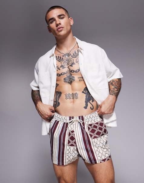 ASOS DESIGN swim shorts in super short length in patchwork print in burgundy - view 1