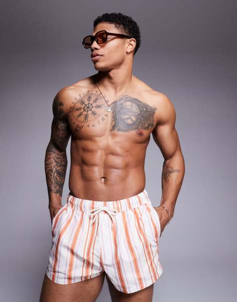 ASOS DESIGN swim shorts in super-short length in white and orange stripe - view 1