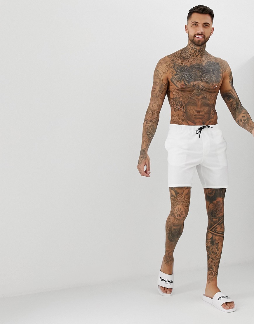 ASOS DESIGN swim shorts in white mid length