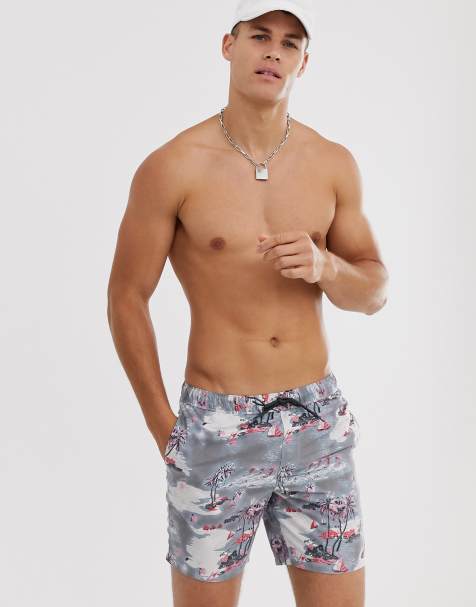 ASOS DESIGN swim shorts with beach scene print in mid length