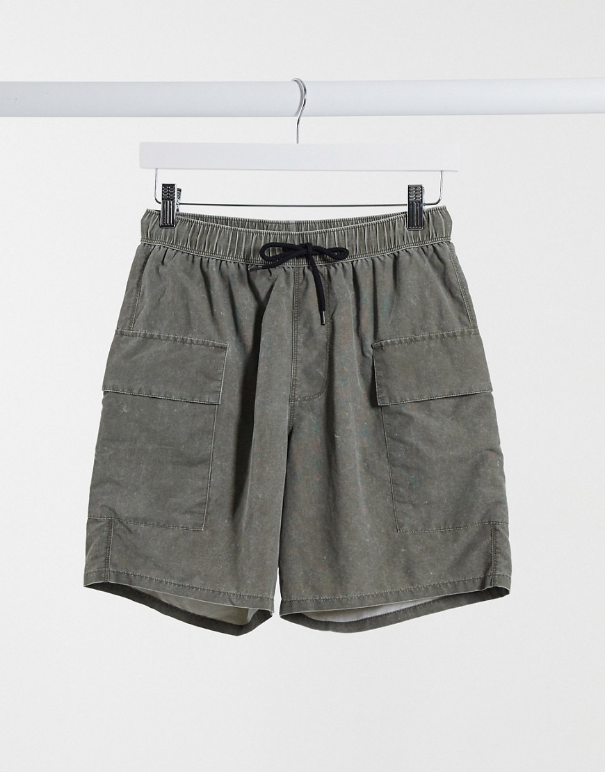 ASOS DESIGN swim shorts with cargo pockets in khaki acid wash-Green