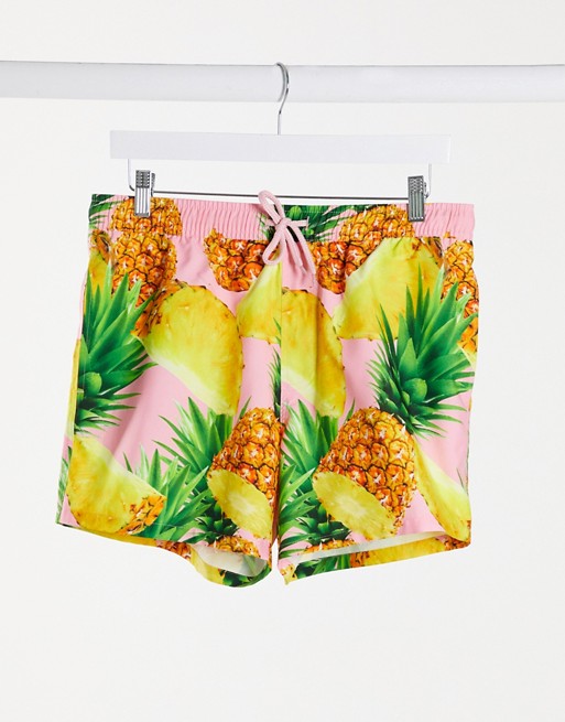 ASOS DESIGN swim shorts with pineapple print in pink short length
