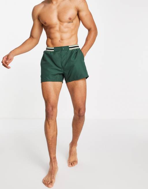 ASOS DESIGN swim shorts in short length with contrast waistband in