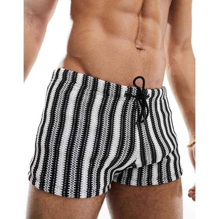 Black and white store striped swim trunks