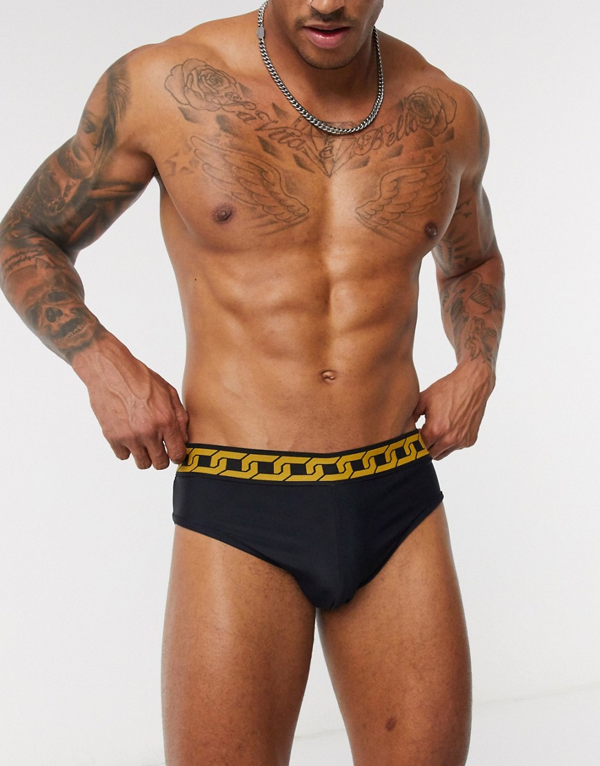 ASOS DESIGN swim trunks in black with chain waistband