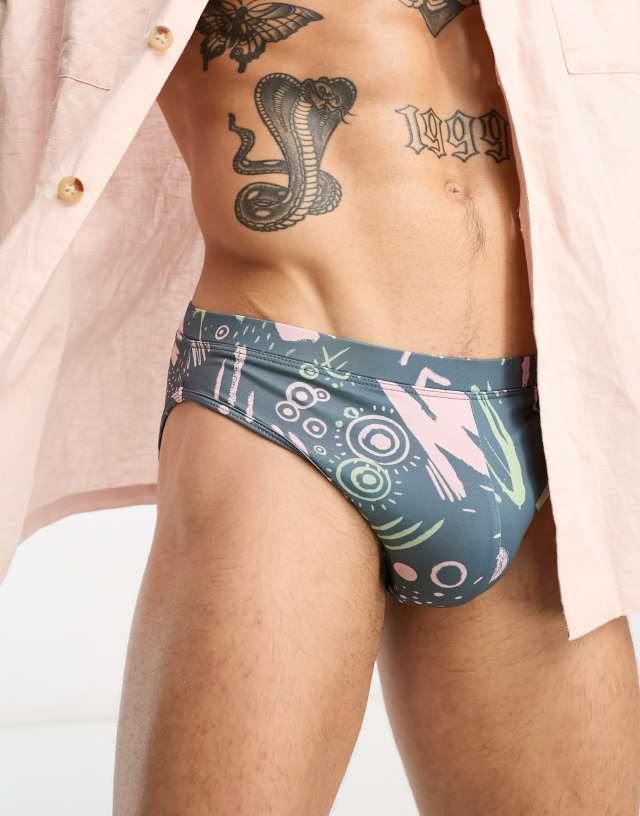 ASOS DESIGN swim trunks in scribble shape print