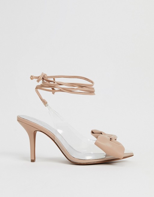 ASOS DESIGN Sylvie tie leg mid-heels with bow in beige and clear