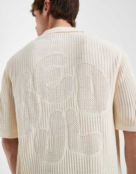 ASOS DESIGN – Szarobeżowa szydełkowana koszulka dzianinowa polo oversize z krótkimi rękawami, wycięciem przy dekolcie i haftowanym napisem „Seoul” - view 1