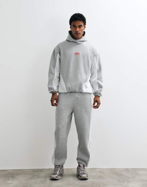 ASOS DESIGN – Szary melanżowy zestaw z wypustkami, przeszyciami i gumową naszywką: bluza oversize z wysokim kołnierzem i kapturem oraz zwężane joggersy - view 1