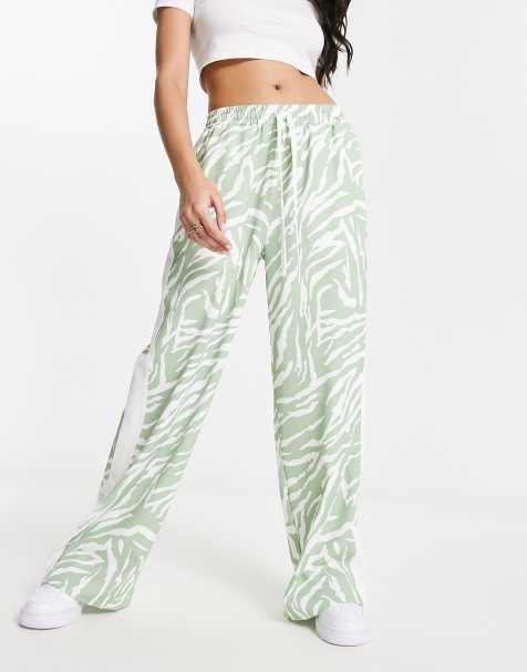 ASOS DESIGN pull on trouser with contrast panel in animal print in sage 
