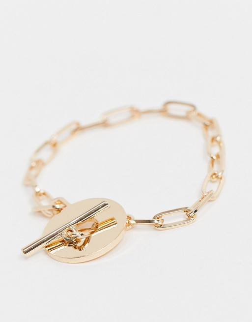 ASOS DESIGN t bar bracelet with circle disc in gold tone