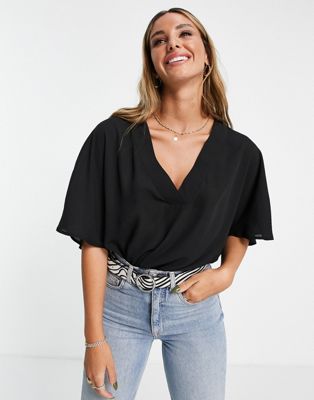 Chemises et blouses T-shirt col en V oversize à ourlet fendu - Noir