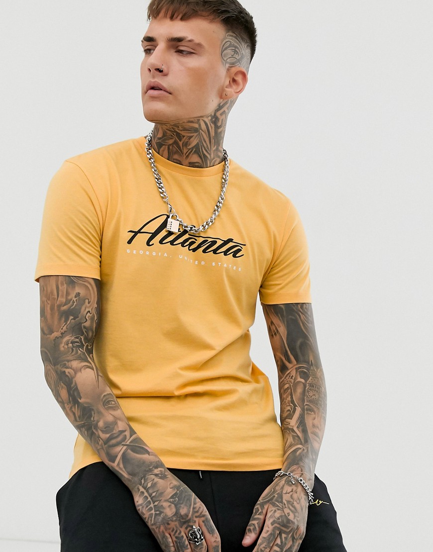 ASOS DESIGN - T-shirt comoda con stampa di città-Arancione