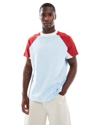 ASOS DESIGN - T-shirt décontracté à manches raglan contrastantes - Bleu