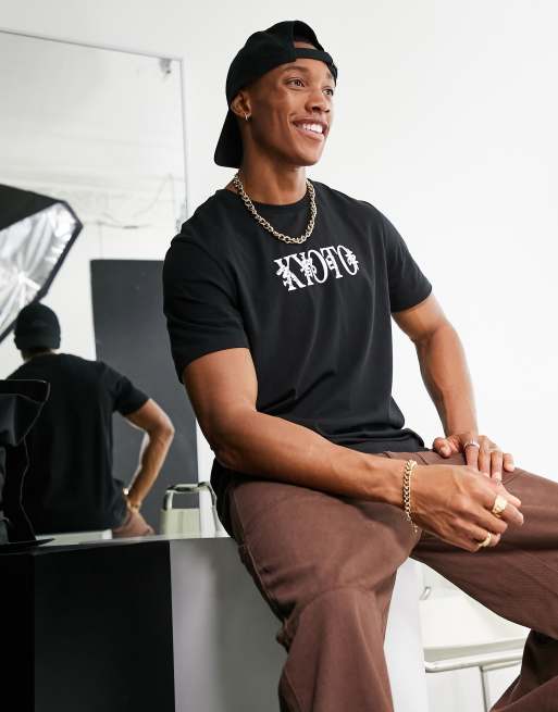 ASOS DESIGN t-shirt in black with city chest print
