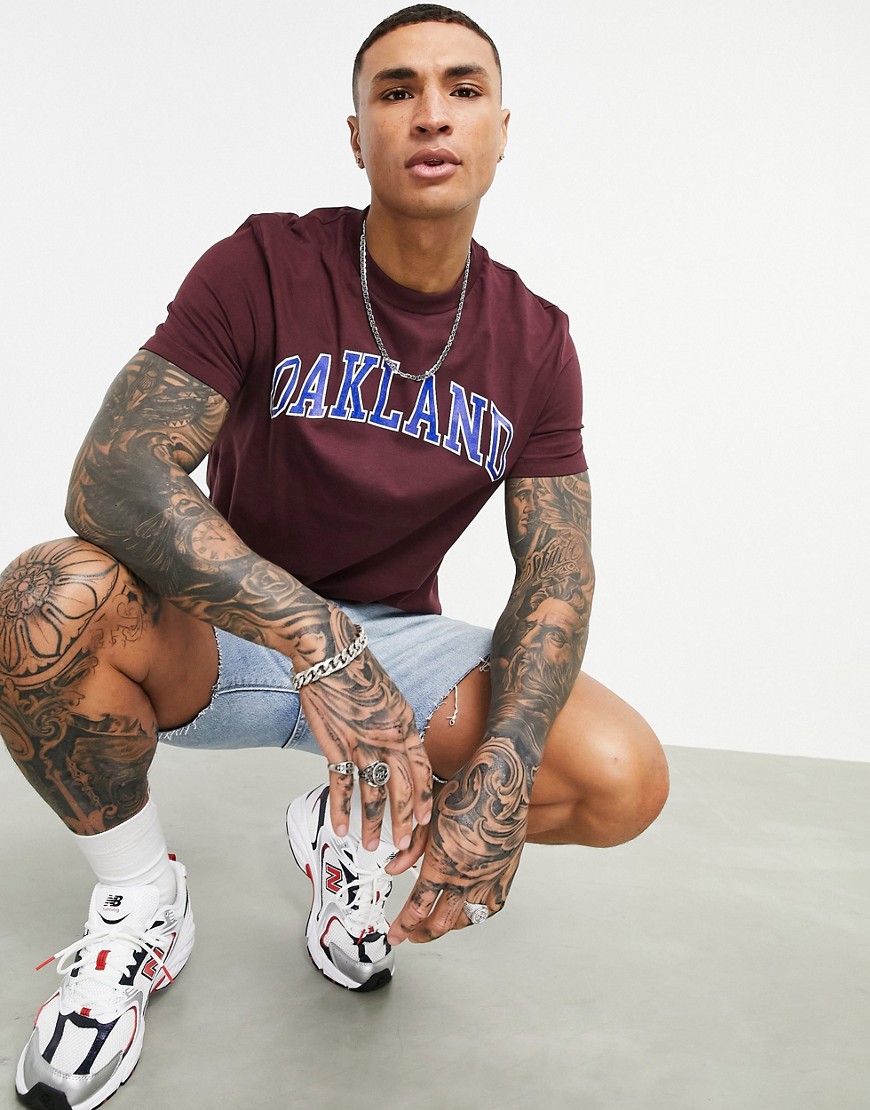 ASOS DESIGN t-shirt in burgundy organic cotton with Oakland collegiate print-Red